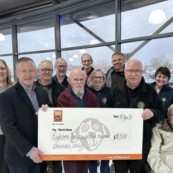 CH CEO John Brebner Accepts CHQ from Alan Pirie Rotary Raffle Organiser