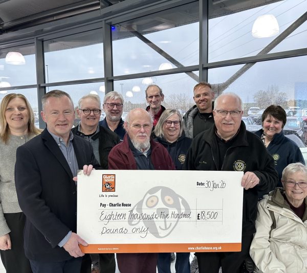 CH CEO John Brebner Accepts CHQ from Alan Pirie Rotary Raffle Organiser